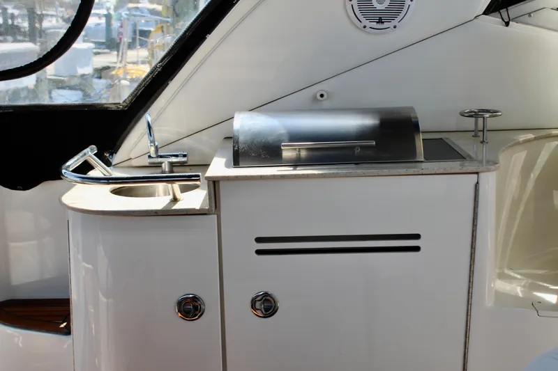 Slide: The Image of 2011 Sea Ray Sundancer 350 yacht kitchenette with sink and grill. - 9