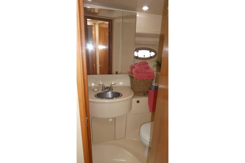 Slide: The Image of Bathroom interior of 2003 Meridian 341 Sedan yacht with sink and porthole window. - 15