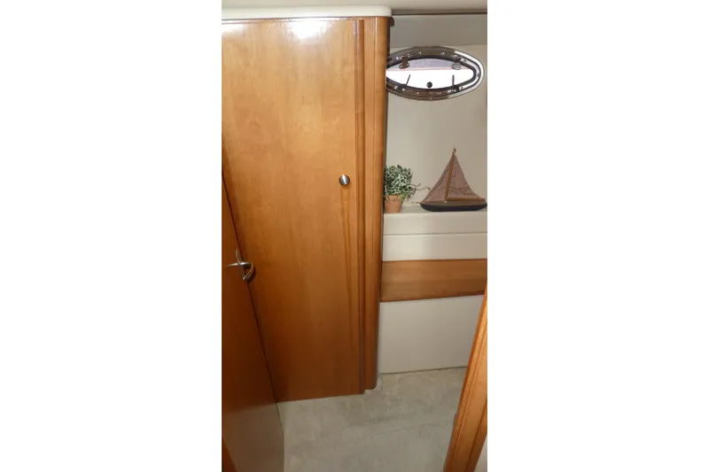 Slide: The Image of Interior of 2003 Meridian 341 Sedan with wooden cabinetry and decorative elements. - 19