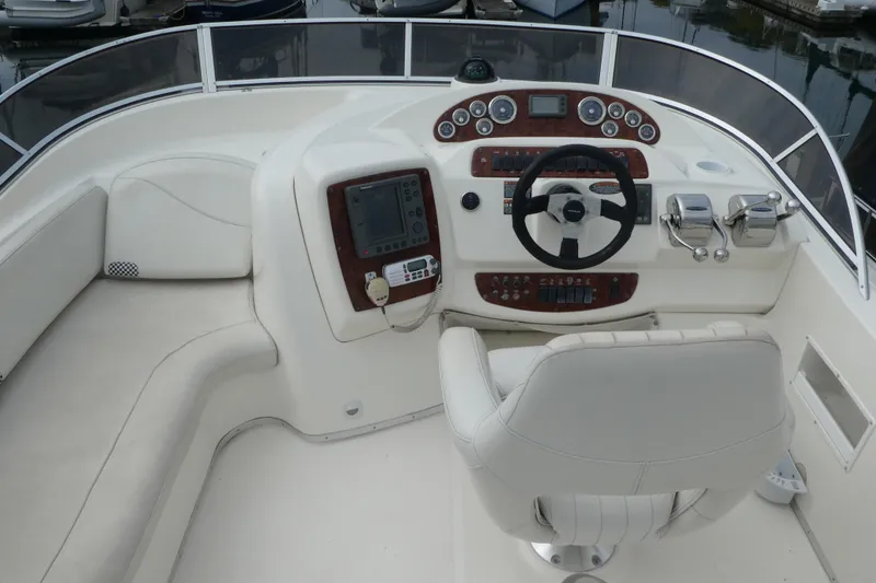 Slide: The Image of Cockpit of 2003 Meridian 341 Sedan with steering wheel and control panel. - 26