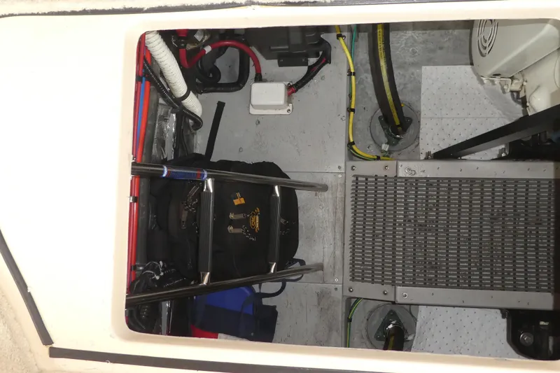 Slide: The Image of Engine compartment of a 2003 Meridian 341 Sedan with visible wiring and equipment. - 30