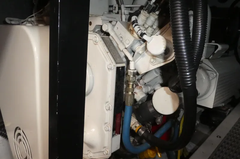 Slide: The Image of Engine compartment of a 2003 Meridian 341 Sedan boat, showcasing mechanical components. - 33