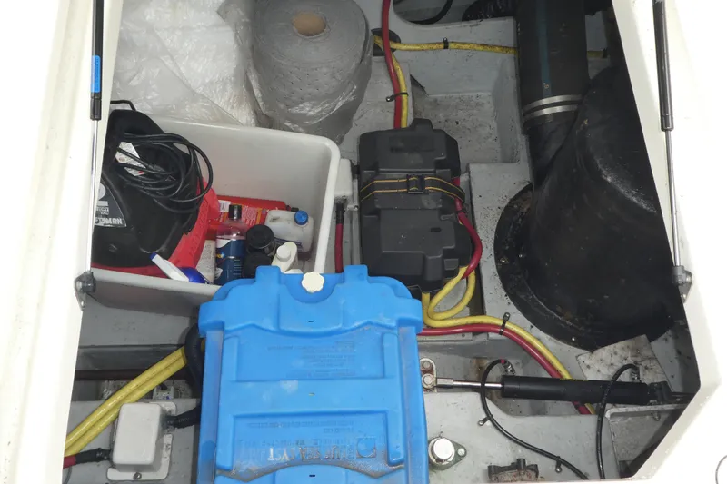 Slide: The Image of Engine compartment of a 2003 Meridian 341 Sedan with various equipment and wiring. - 34