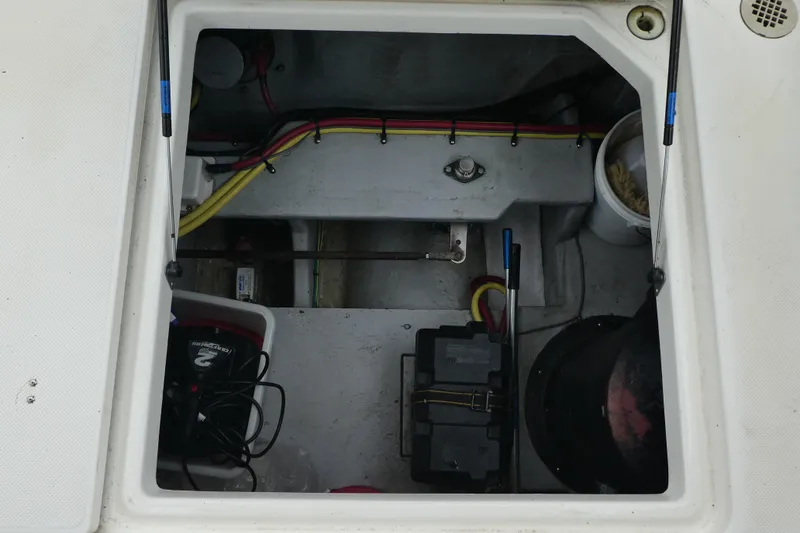 Slide: The Image of Engine compartment of a 2003 Meridian 341 Sedan with visible wiring and battery. - 35