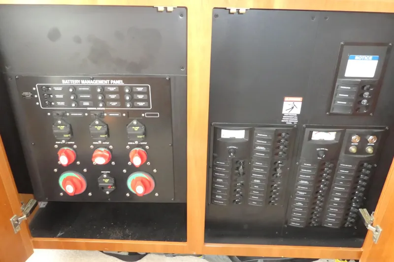 Slide: The Image of Battery management panel on 2003 Meridian 341 Sedan yacht, featuring switches and circuit breakers. - 8