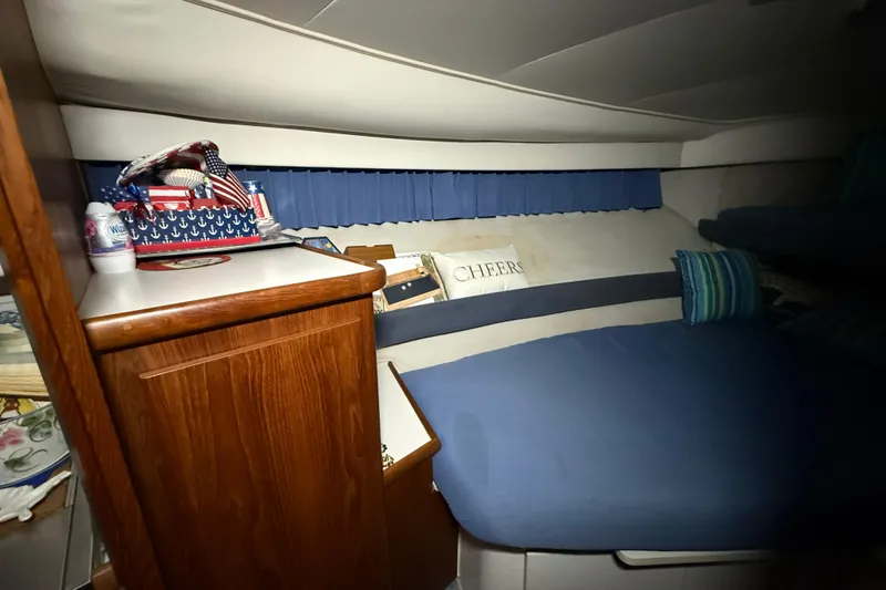 Slide: The Image of Cozy interior of 1994 Carver 390 Cockpit Motor Yacht with nautical decor and cushions. - 16
