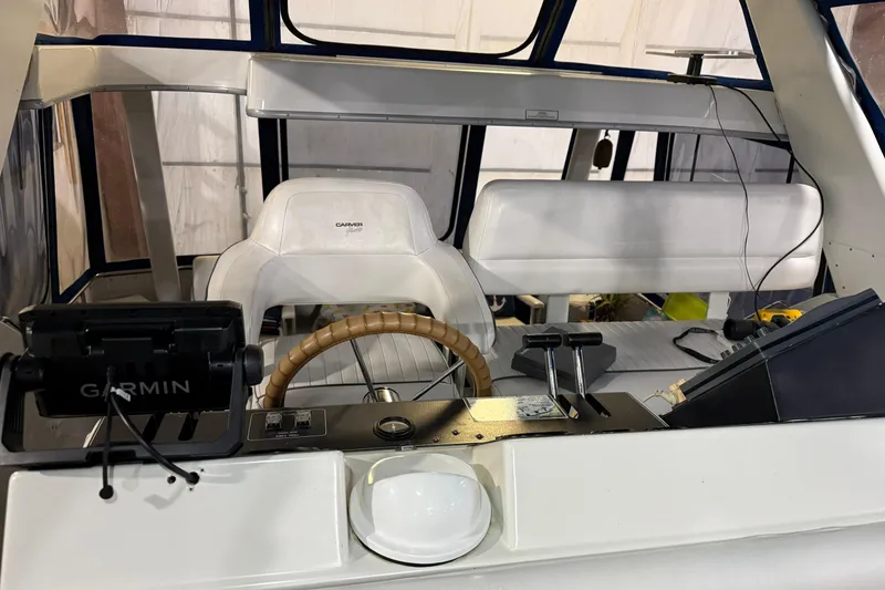 Slide: The Image of 1994 Carver 390 Cockpit Motor Yacht helm with Garmin navigation and leather steering wheel. - 17
