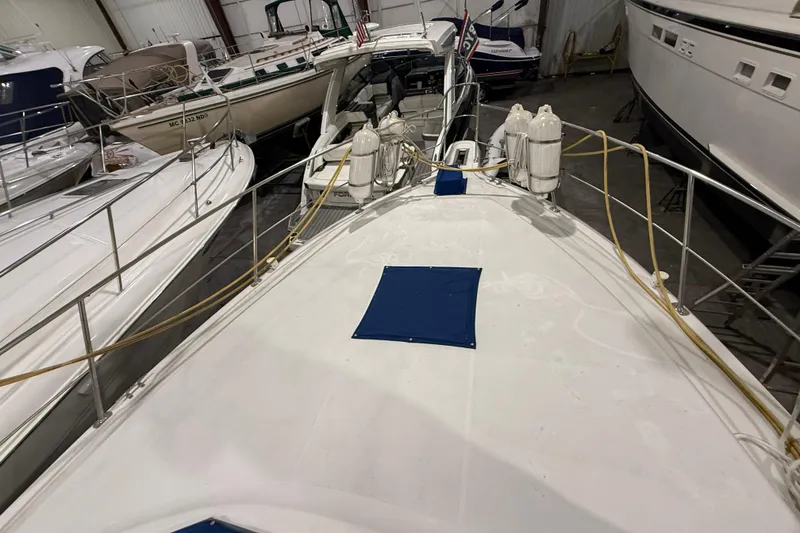 Slide: The Image of 1994 Carver 390 Cockpit Motor Yacht in storage, surrounded by other boats. - 22