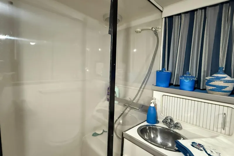 Slide: The Image of Bathroom interior of 1994 Carver 390 Cockpit Motor Yacht with shower and sink. - 7