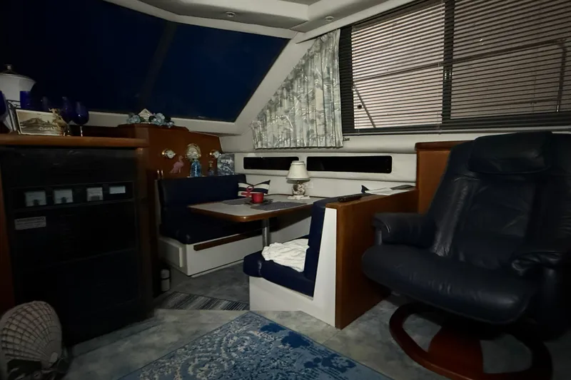 Slide: The Image of Interior of 1994 Carver 390 Cockpit Motor Yacht with seating and decor. - 9