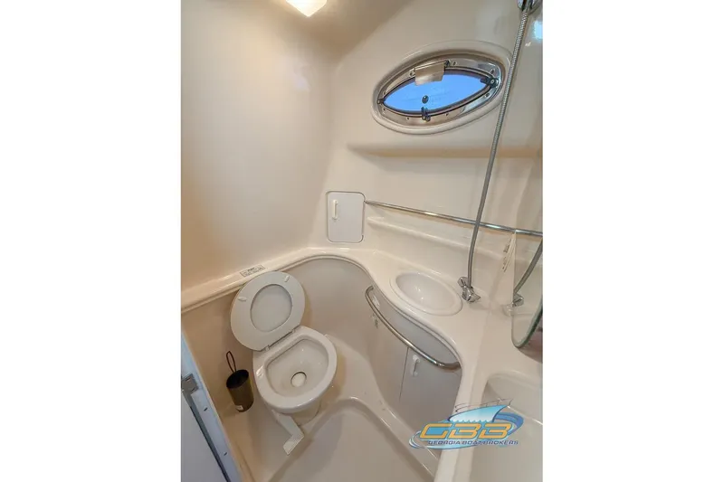 Slide: The Image of Bathroom interior of 2000 Sea Ray 340 Sundancer yacht with toilet and sink. - 12