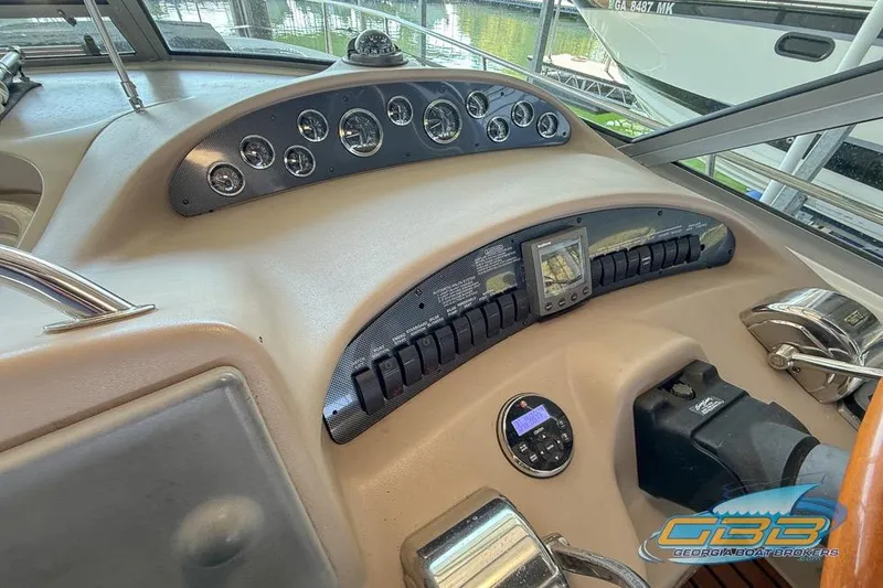 Slide: The Image of Control panel of a 2000 Sea Ray 340 Sundancer boat with gauges and navigation equipment. - 20