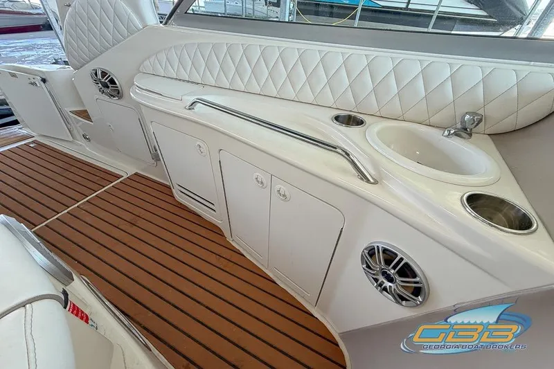 Slide: The Image of Interior view of 2000 Sea Ray 340 Sundancer boat with sink and storage. - 21