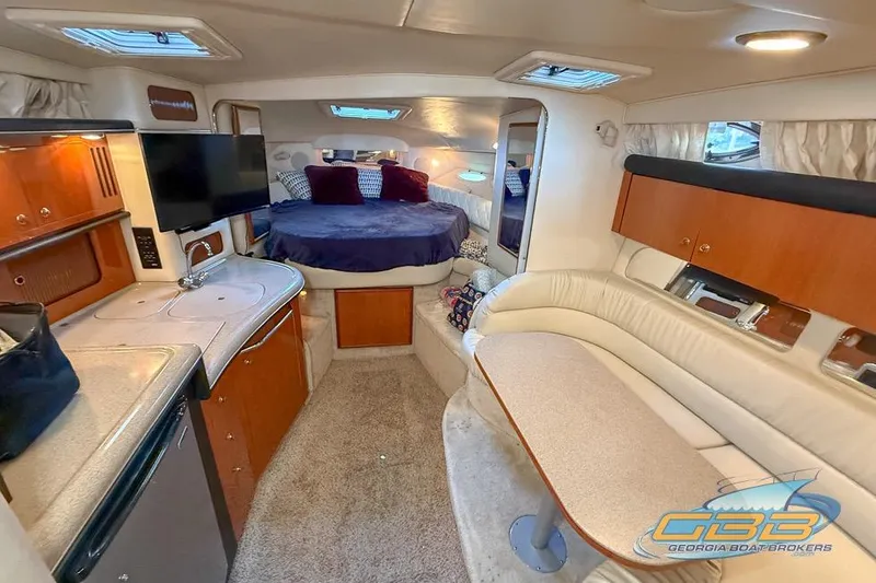 Slide: The Image of Interior of 2000 Sea Ray 340 Sundancer yacht with cozy seating and modern amenities. - 3