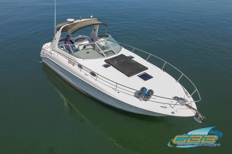 Slide: The Image of 2000 Sea Ray 340 Sundancer boat on calm water, aerial view. - 33