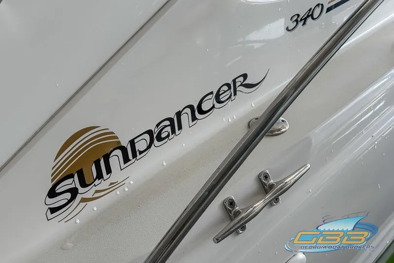 Slide: The Image of Close-up of 2000 Sea Ray 340 Sundancer boat logo and branding. - 38