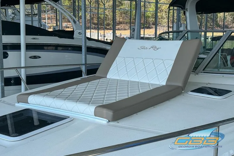 Slide: The Image of Sunpad on 2000 Sea Ray 340 Sundancer, featuring quilted design and logo. - 40