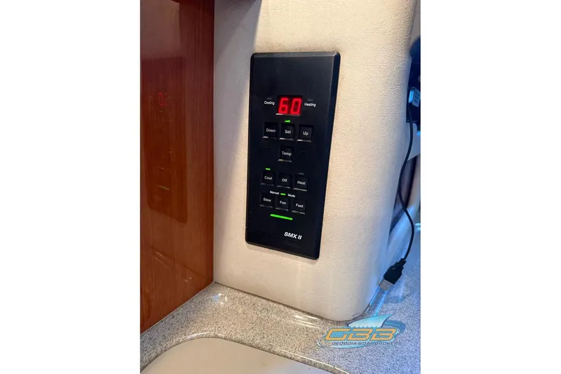 Slide: The Image of Control panel of a 2000 Sea Ray 340 Sundancer boat, displaying temperature settings. - 42
