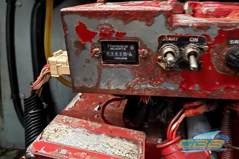 Slide: The Image of Close-up of a worn control panel on a 2000 Sea Ray 340 Sundancer boat. - 43