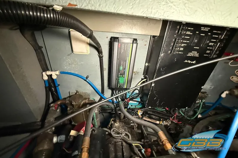 Slide: The Image of Engine compartment of a 2000 Sea Ray 340 Sundancer with wiring and control panel. - 45