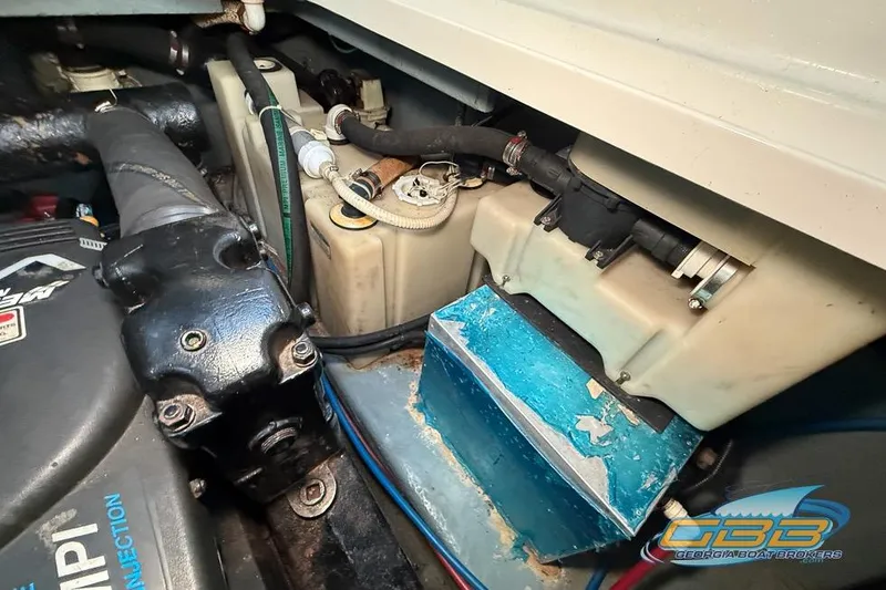 Slide: The Image of Engine compartment of a 2000 Sea Ray 340 Sundancer boat, showing mechanical components. - 46