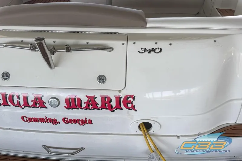 Slide: The Image of 2000 Sea Ray 340 Sundancer boat stern with custom lettering, docked in Cumming, Georgia. - 48