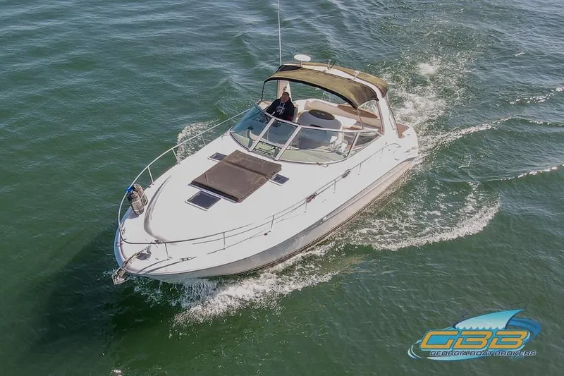 Slide: The Image of 2000 Sea Ray 340 Sundancer cruising on open water, aerial view. - 7