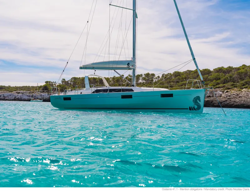 Slide: The Image of 2017 Beneteau Oceanis 41.1 sailboat on turquoise water. - 18