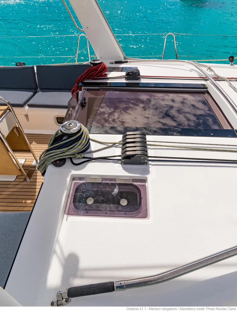 Slide: The Image of Beneteau Oceanis 41.1 deck with ropes and turquoise water, 2017 model. - 21