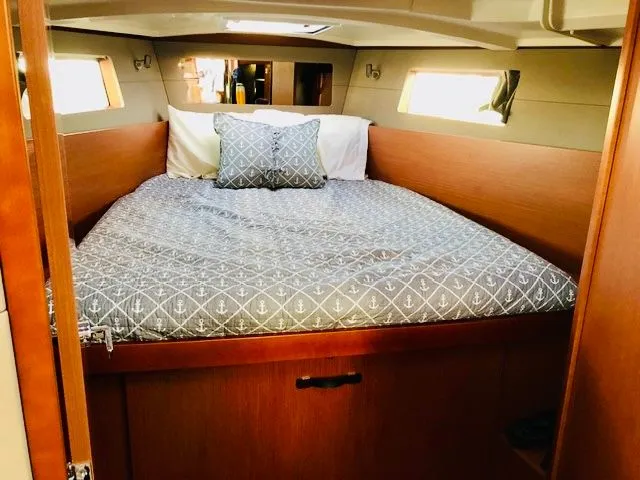 Slide: The Image of Interior of Beneteau Oceanis 41.1 yacht, cozy bedroom with bed. - 4