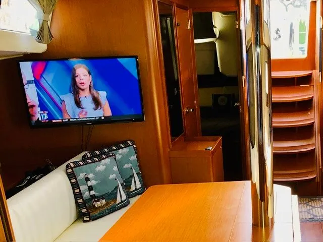 Slide: The Image of Interior of a 2017 Beneteau Oceanis 41.1 with TV and cushions. - 6