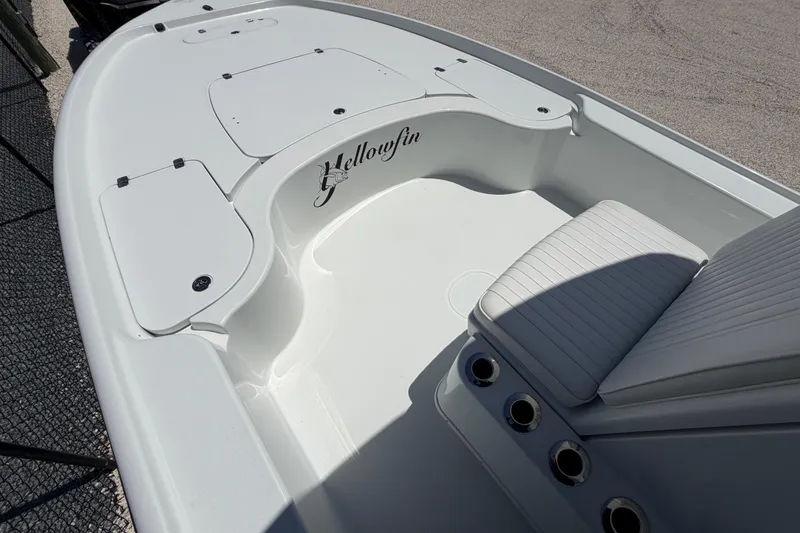 Slide: The Image of 2012 Yellowfin 24 Bay boat interior with seating and storage compartments. - 5