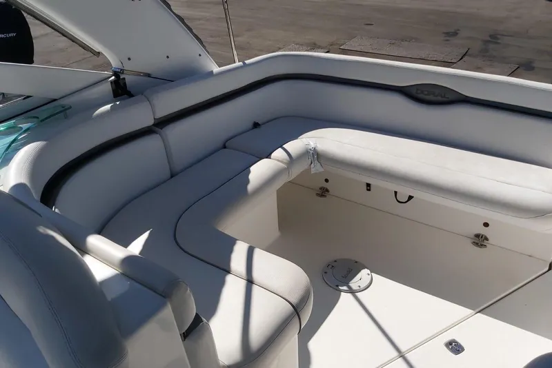 Slide: The Image of 2007 Doral Intrigue boat interior with white seating and sleek design. - 10