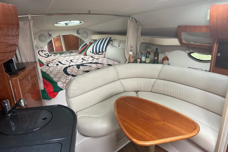 Slide: The Image of Interior of a 2007 Doral Intrigue boat with luxury seating and bedding. - 15