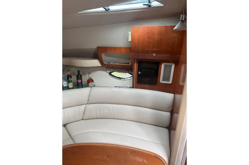 Slide: The Image of Luxurious interior of 2007 Doral Intrigue yacht with leather seating and wooden cabinetry. - 16