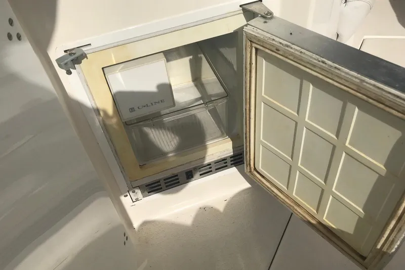 Slide: The Image of Open U-Line ice maker on a 2007 Doral Intrigue boat deck. - 26