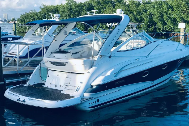 Slide: The Image of 2007 Doral Intrigue boat docked, featuring sleek design and modern amenities. - 3