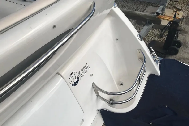 Slide: The Image of 2007 Doral Intrigue boat stern with stainless steel railings and InterMarine logo. - 30