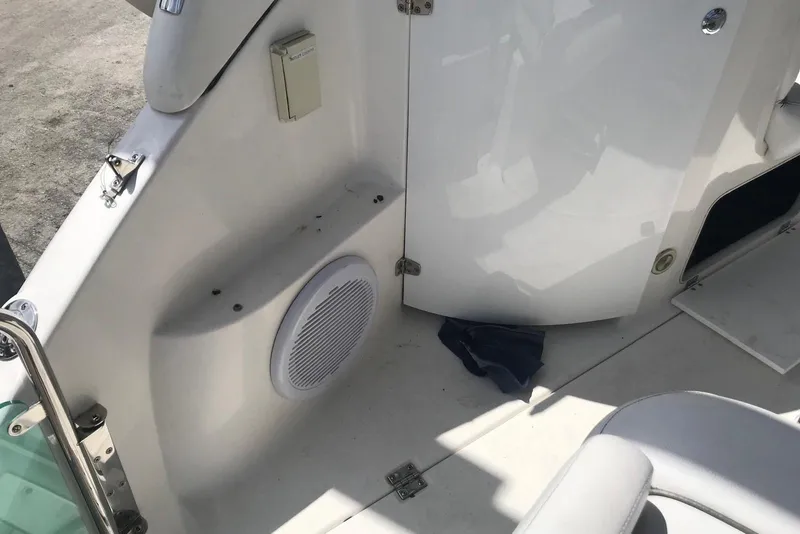 Slide: The Image of 2007 Doral Intrigue boat interior with speaker and seating area. - 37