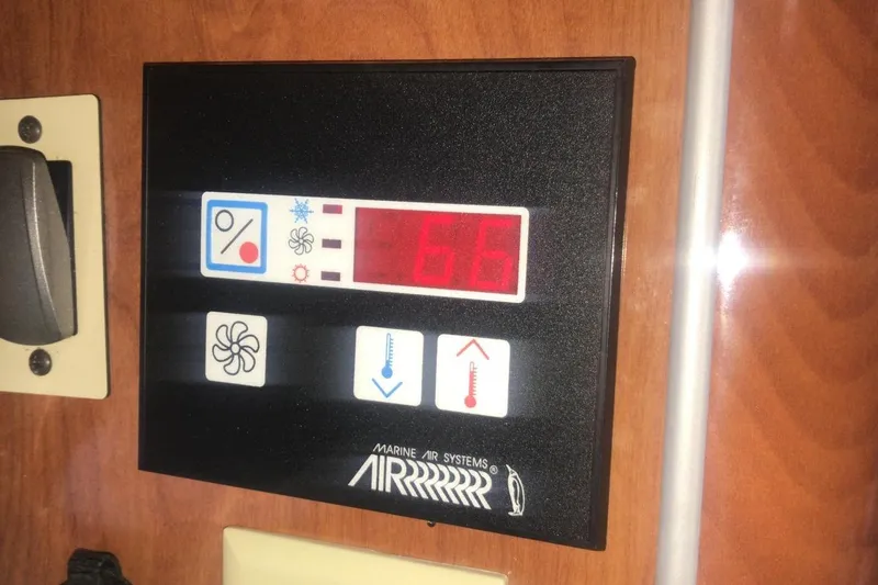 Slide: The Image of Digital control panel on a 2007 Doral Intrigue boat, displaying temperature settings. - 38