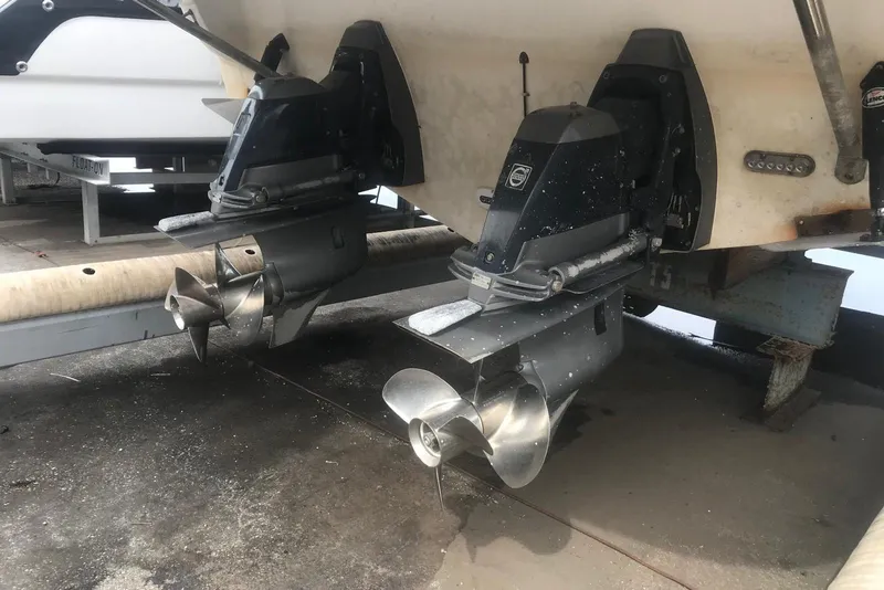 Slide: The Image of 2007 Doral Intrigue boat with dual outboard motors on a trailer. - 39