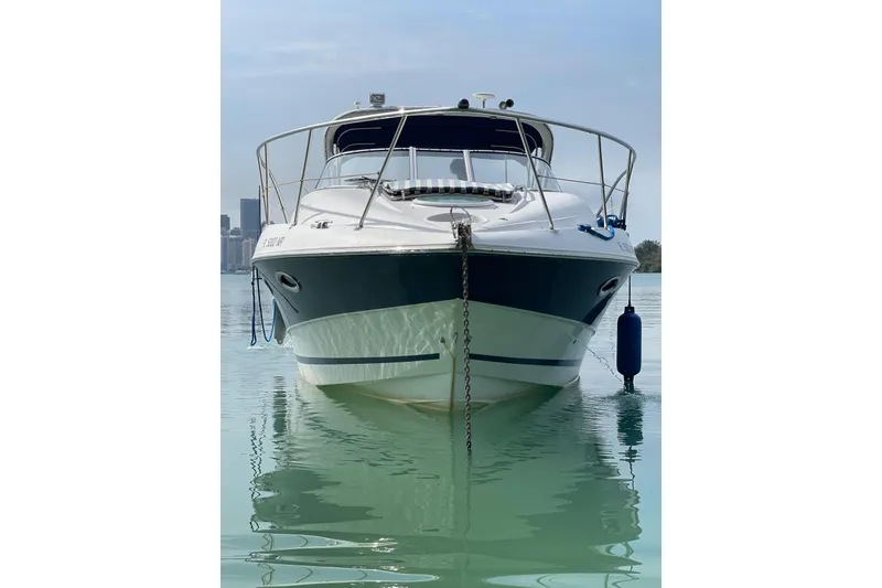 Slide: The Image of Front view of a 2007 Doral Intrigue boat on calm water. - 6