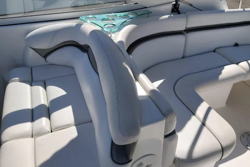 Slide: The Image of Luxurious seating on a 2007 Doral Intrigue boat with elegant white upholstery. - 8
