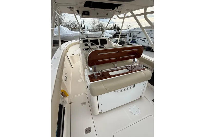 Slide: The Image of 2016 Pursuit S 280 Sport boat interior with helm and seating area. - 11