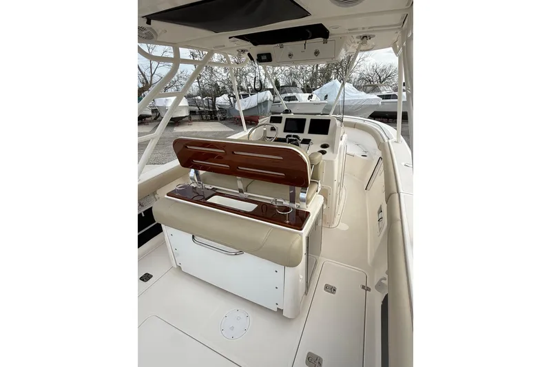 Slide: The Image of 2016 Pursuit S 280 Sport boat interior with helm, seating, and navigation equipment. - 14