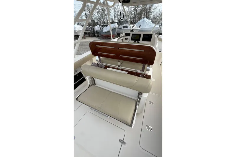 Slide: The Image of 2016 Pursuit S 280 Sport boat interior with helm seating and dashboard. - 15