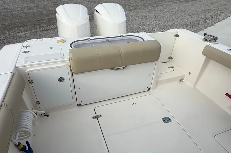 Slide: The Image of 2016 Pursuit S 280 Sport boat interior with seating and storage compartments. - 20