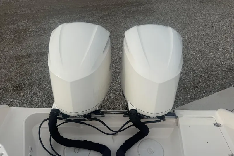 Slide: The Image of Twin outboard engines on a 2016 Pursuit S 280 Sport boat, viewed from above. - 21