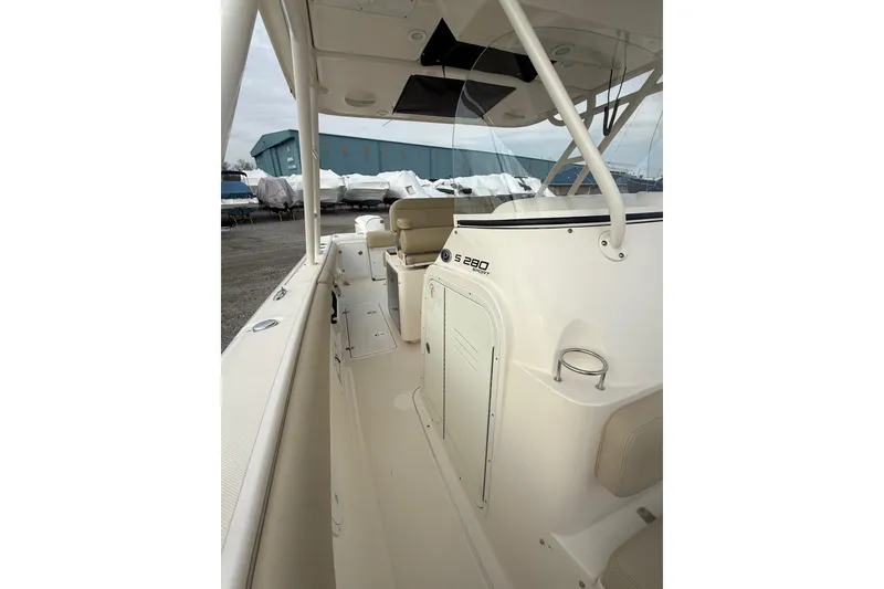 Slide: The Image of 2016 Pursuit S 280 Sport boat interior with seating and storage compartments. - 22