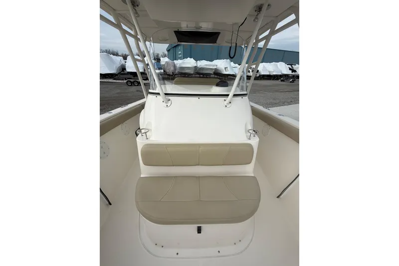 Slide: The Image of 2016 Pursuit S 280 Sport boat interior with beige seating and sturdy frame. - 23